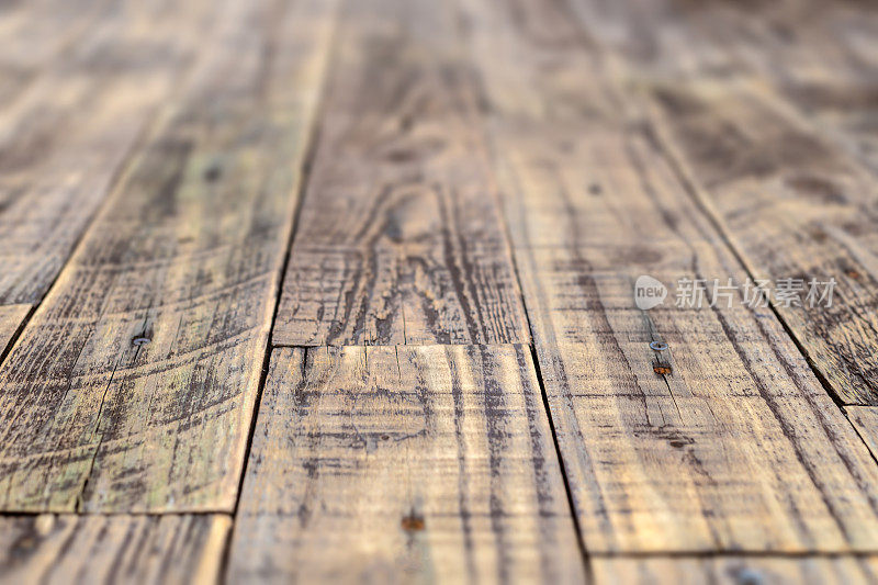 质朴的粗糙木质地板/桌面具有浅景深